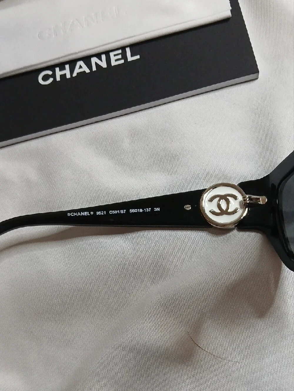 CHANEL Black Cat-Eye Sunglasses with White/Silver CC Emblem